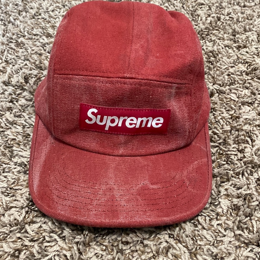 Red Supreme camp hat.